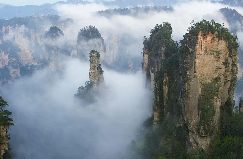 Panoramic Zhangjiajie National Forest Park sandstone pillars and misty mountain peaks