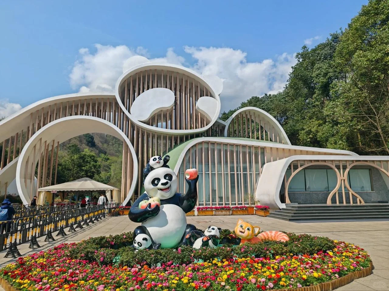 Wolong Shenshuping panda base with giant panda climbing among trees
