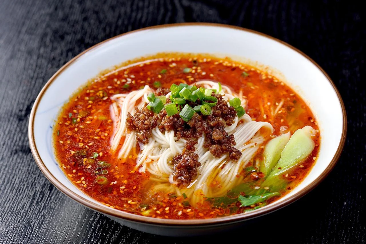 Yangtze River cruise view of Chongqing cliffs, water, and urban skyline