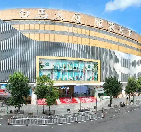 Busy Guangzhou wholesale market aisle with buyers browsing factory-direct goods