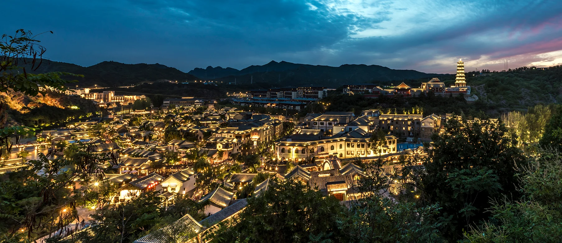 Crowded Beijing hutong street with shops and local food stalls