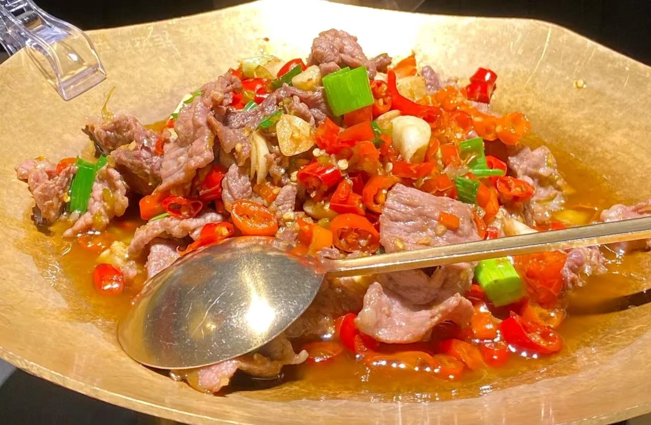 Hunan spicy stir-fry with red chilies and bold regional seasoning