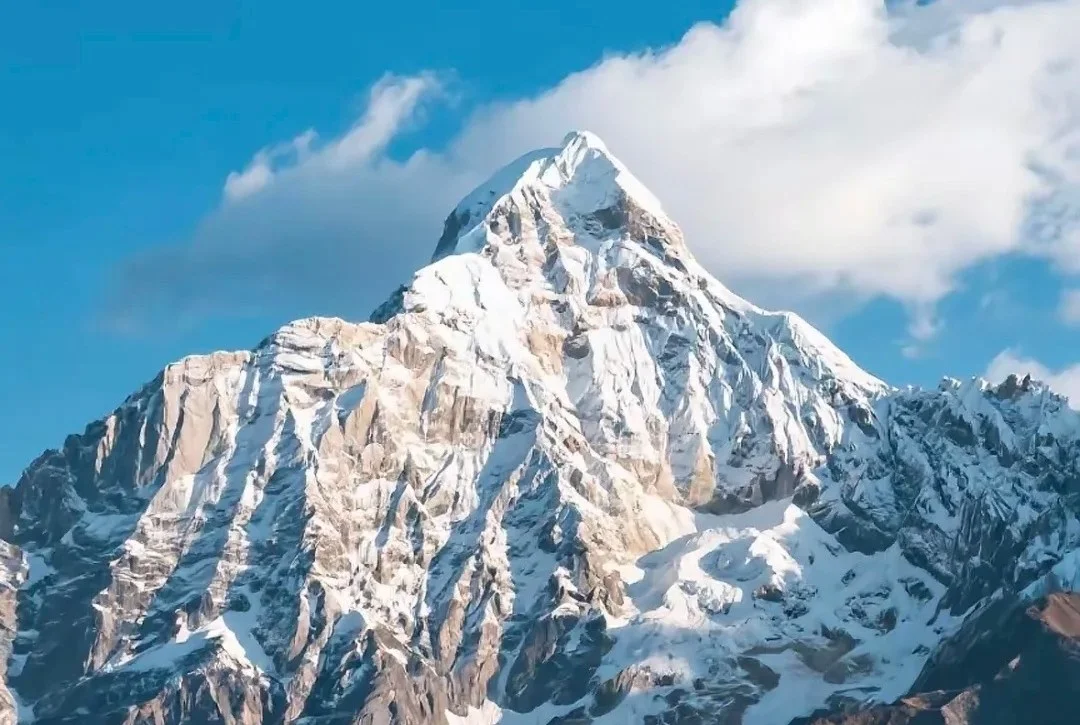 Yubeng village trek beneath Meili Snow Mountain with Tibetan prayer flags