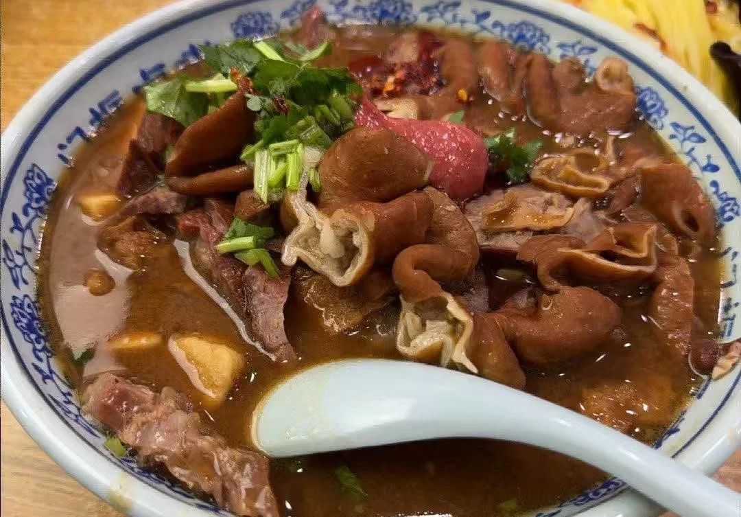 Crispy Beijing roast duck served with pancakes and scallions