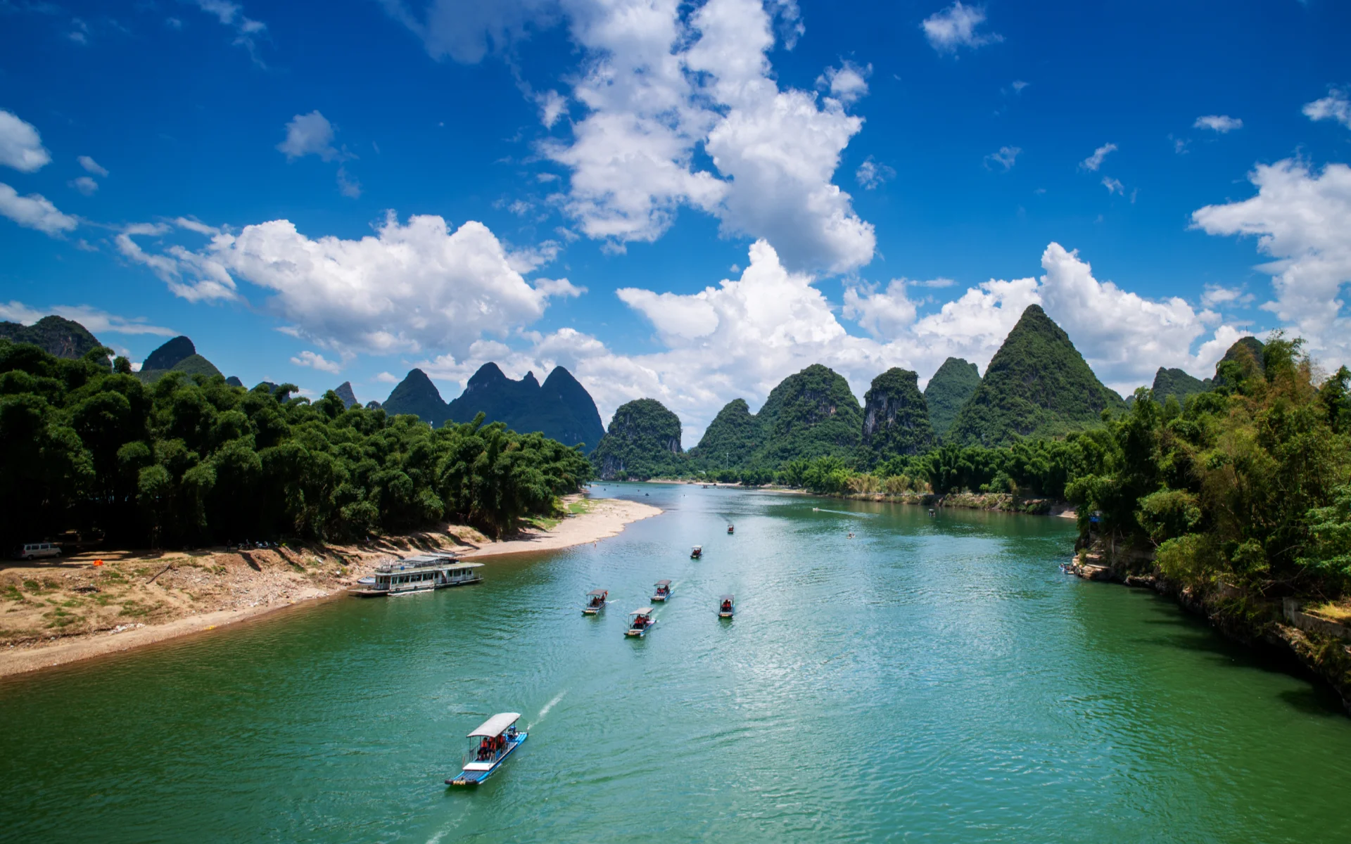 Li River cruise with Guilin karst mountains and misty river scenery