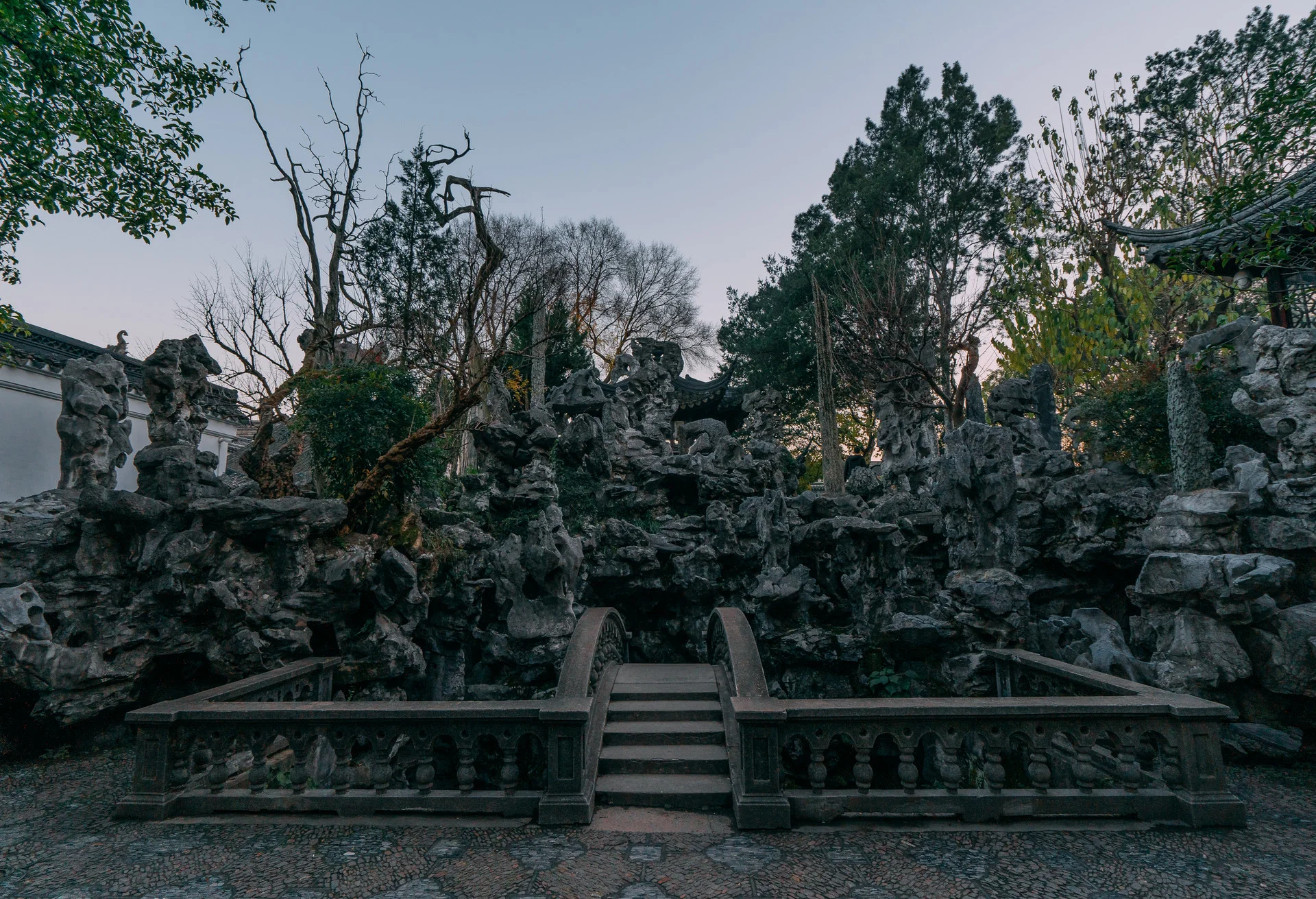 Traditional pavilion beside a lotus pond in one of Suzhou's classical gardens