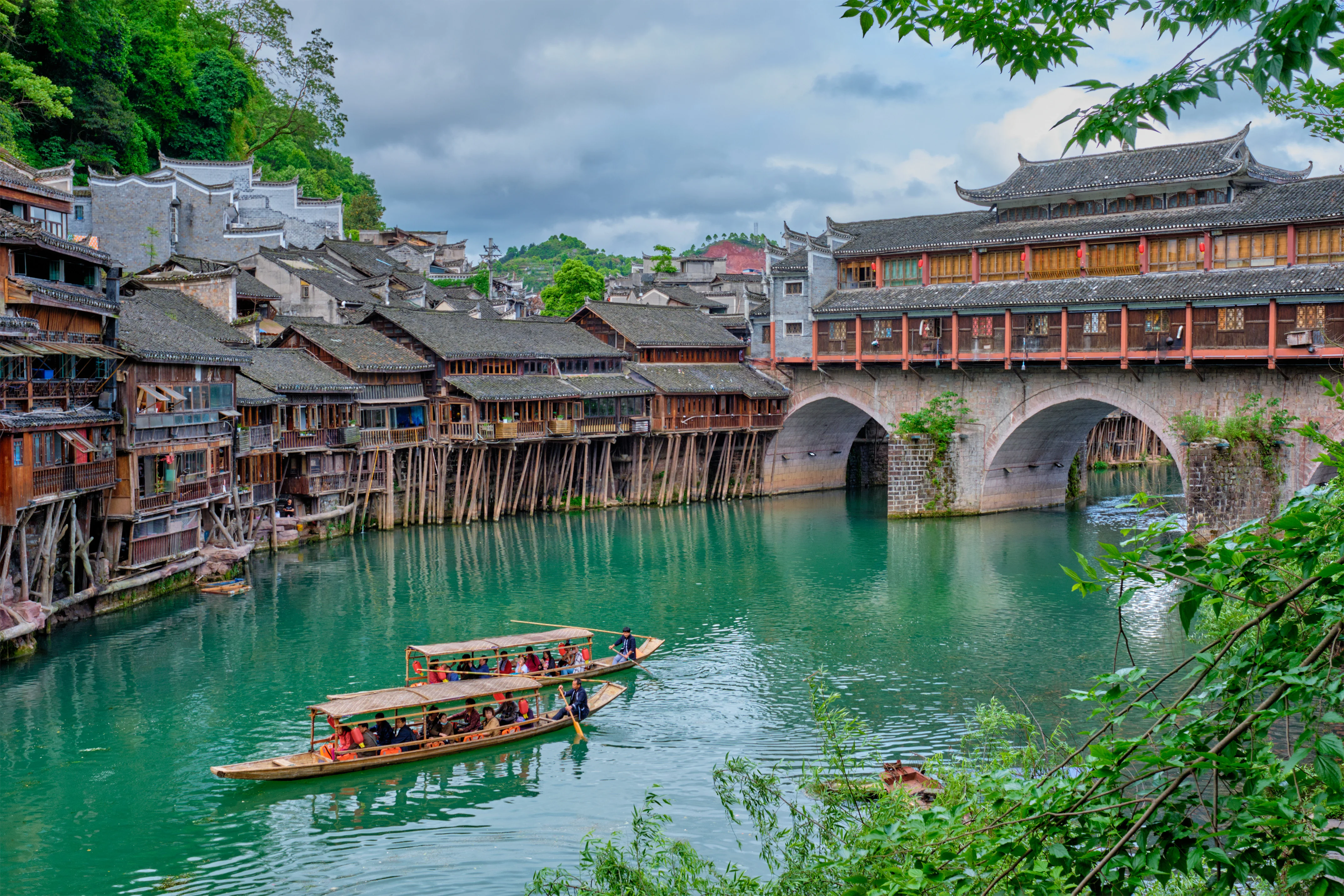 Scenic view of Furong Ancient Town waterfall and stilt houses near Zhangjiajie