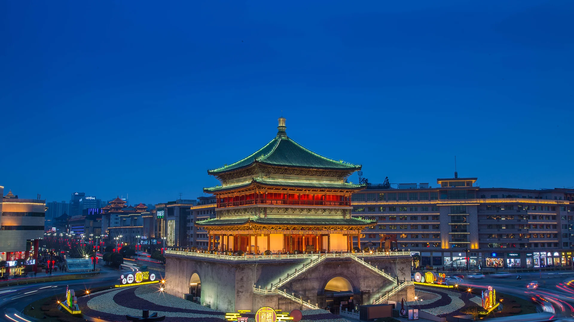 Drum Tower in Xi'an with traditional architecture and visitors in the surrounding square