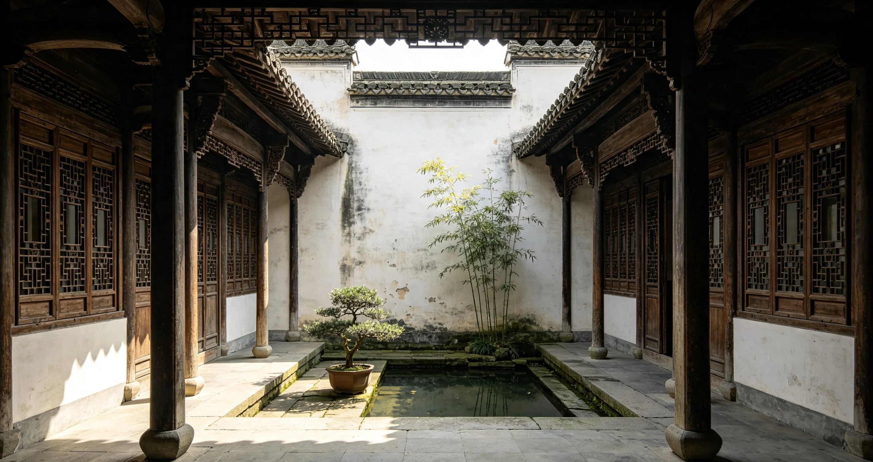 Canal-side homes in a Jiangnan water town with stone bridges and whitewashed walls