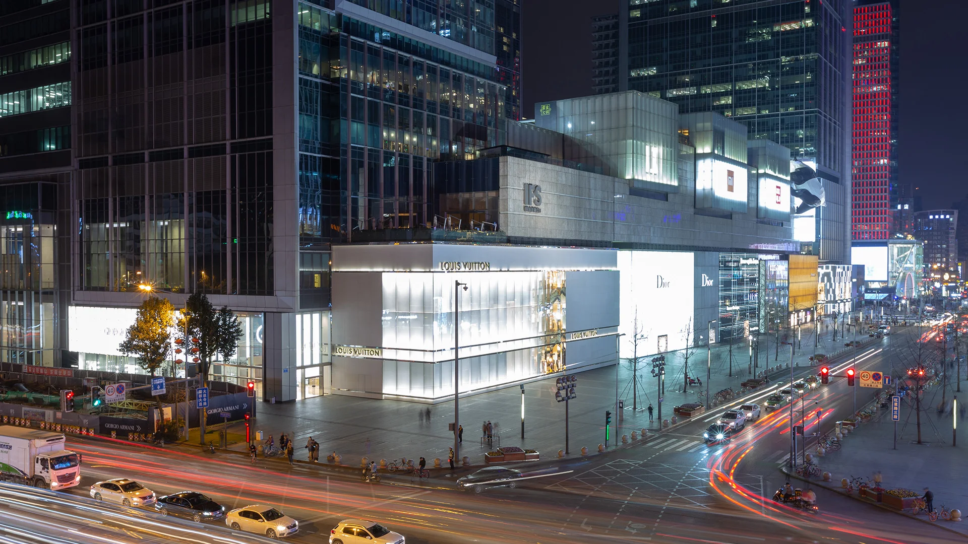 Chengdu IFS shopping mall with modern luxury storefronts and city skyline